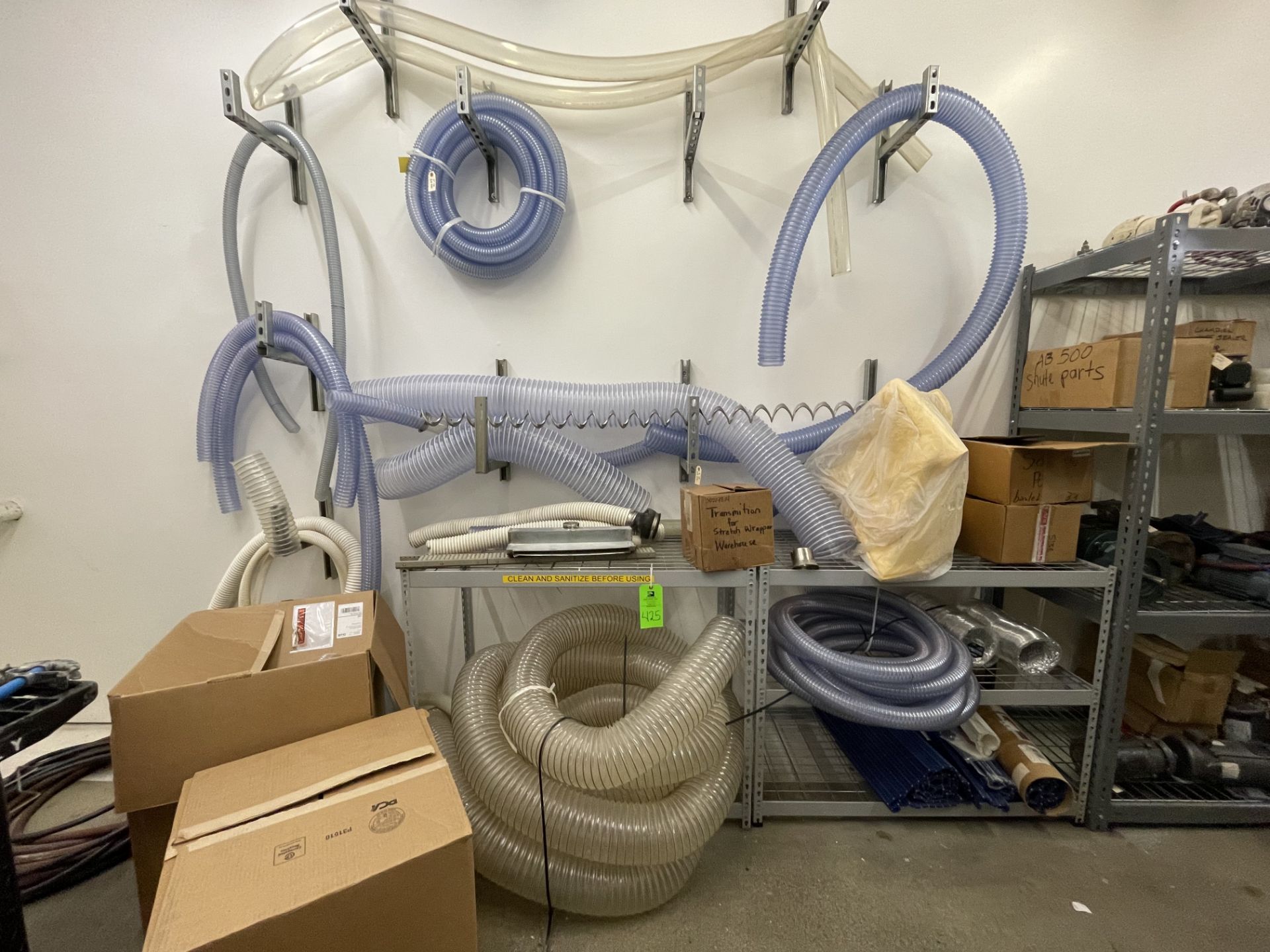 LOT OF vinyl hoses with 2- shelf units and wall mount racks, random diameters and lengths Rigging