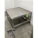 Stainless steel table with caster, 46 in x 57 in x 29 in h Rigging Fee: $ 75