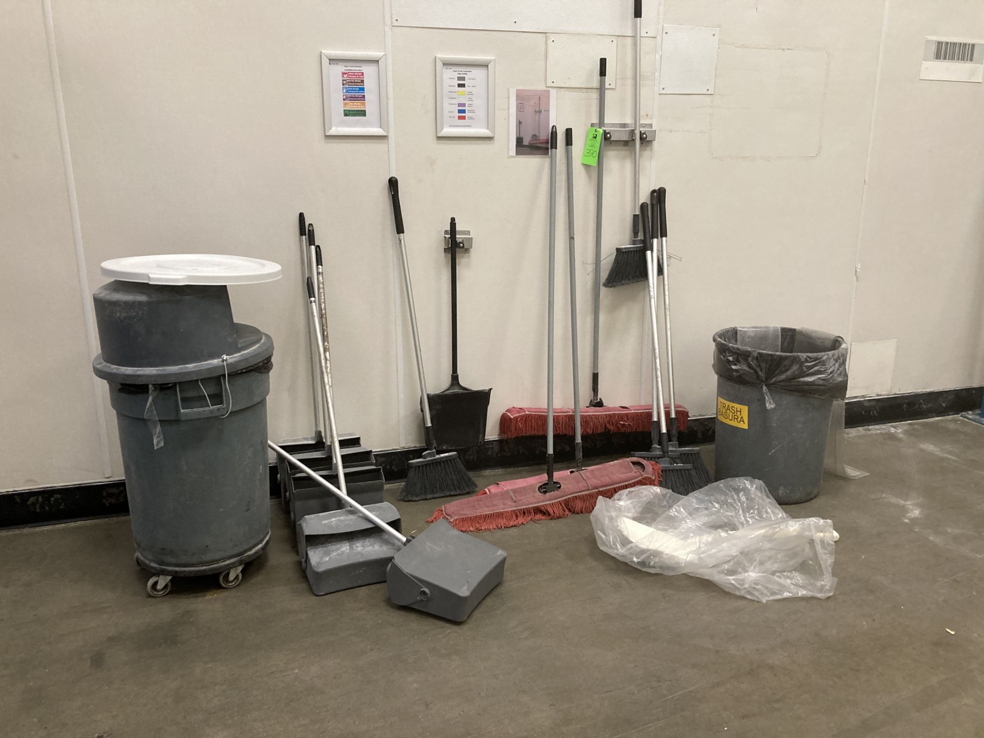 LOT OF waste containers, mops, wall rack, dust pans Rigging Fee: $50