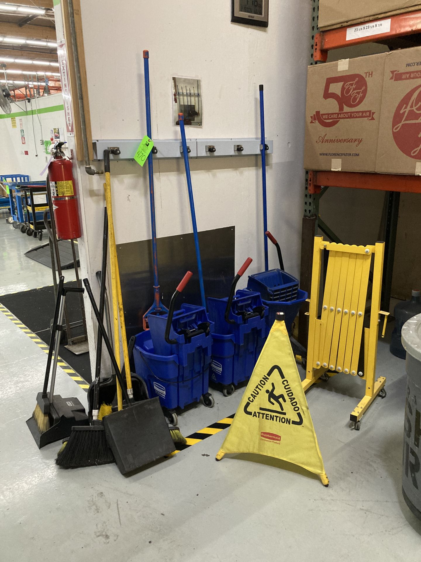 LOT OF mops with bucket, brooms, waste container , portable safety barrier Rigging Fee: $ 100