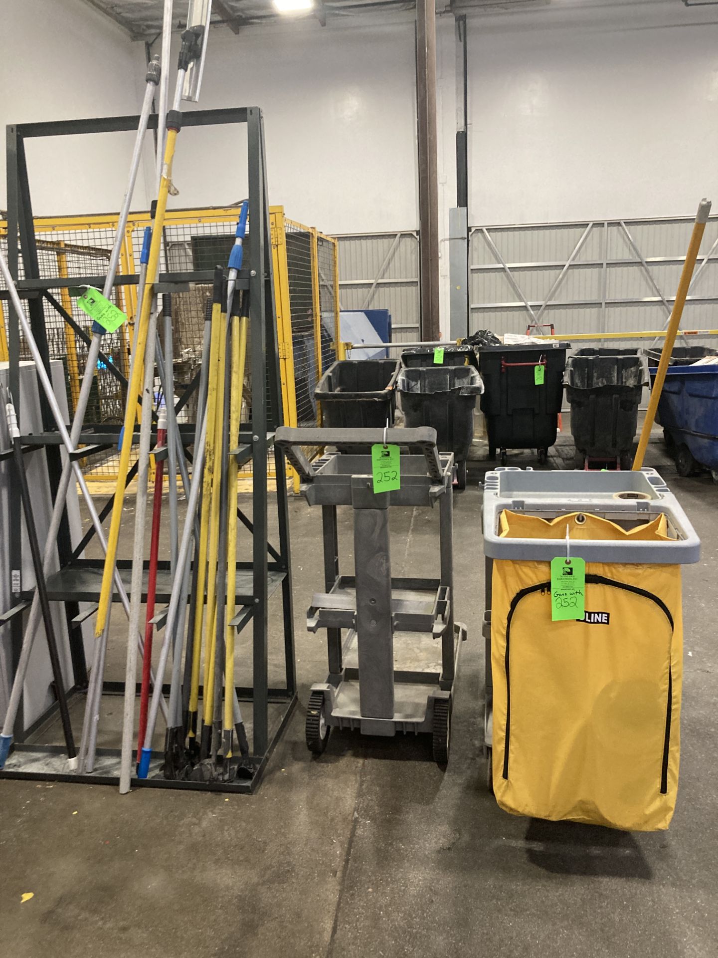 LOT OF pipe shelf unit with content and 2 cleaning push carts Rigging Fee: $ 125