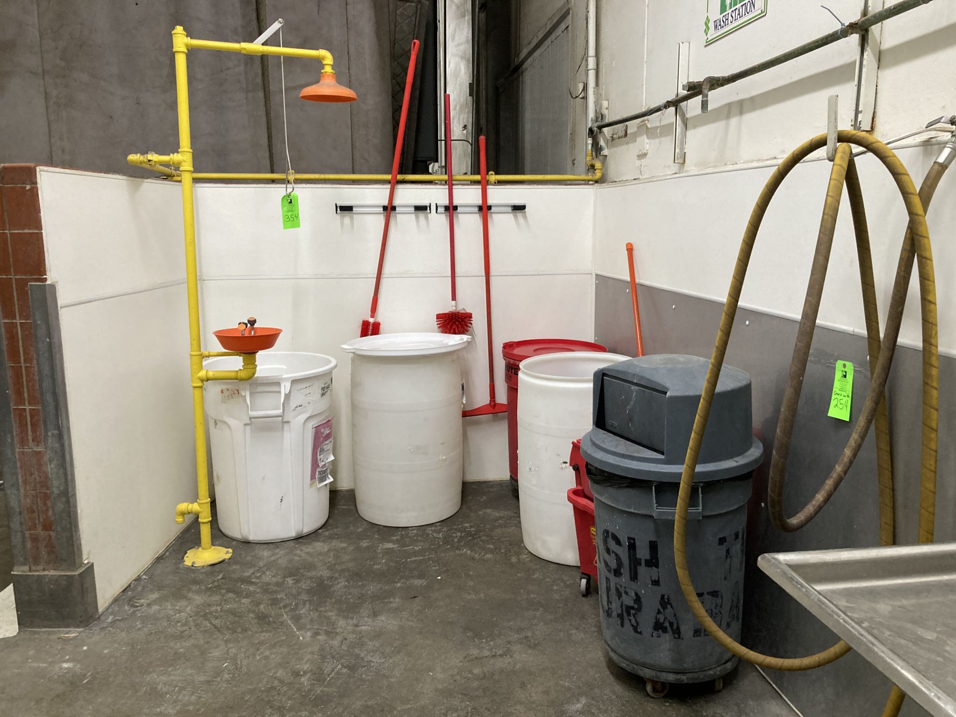 LOT OF waste containers, mop and bucket, brushes, squeegee, wall rack, eye wash shower station