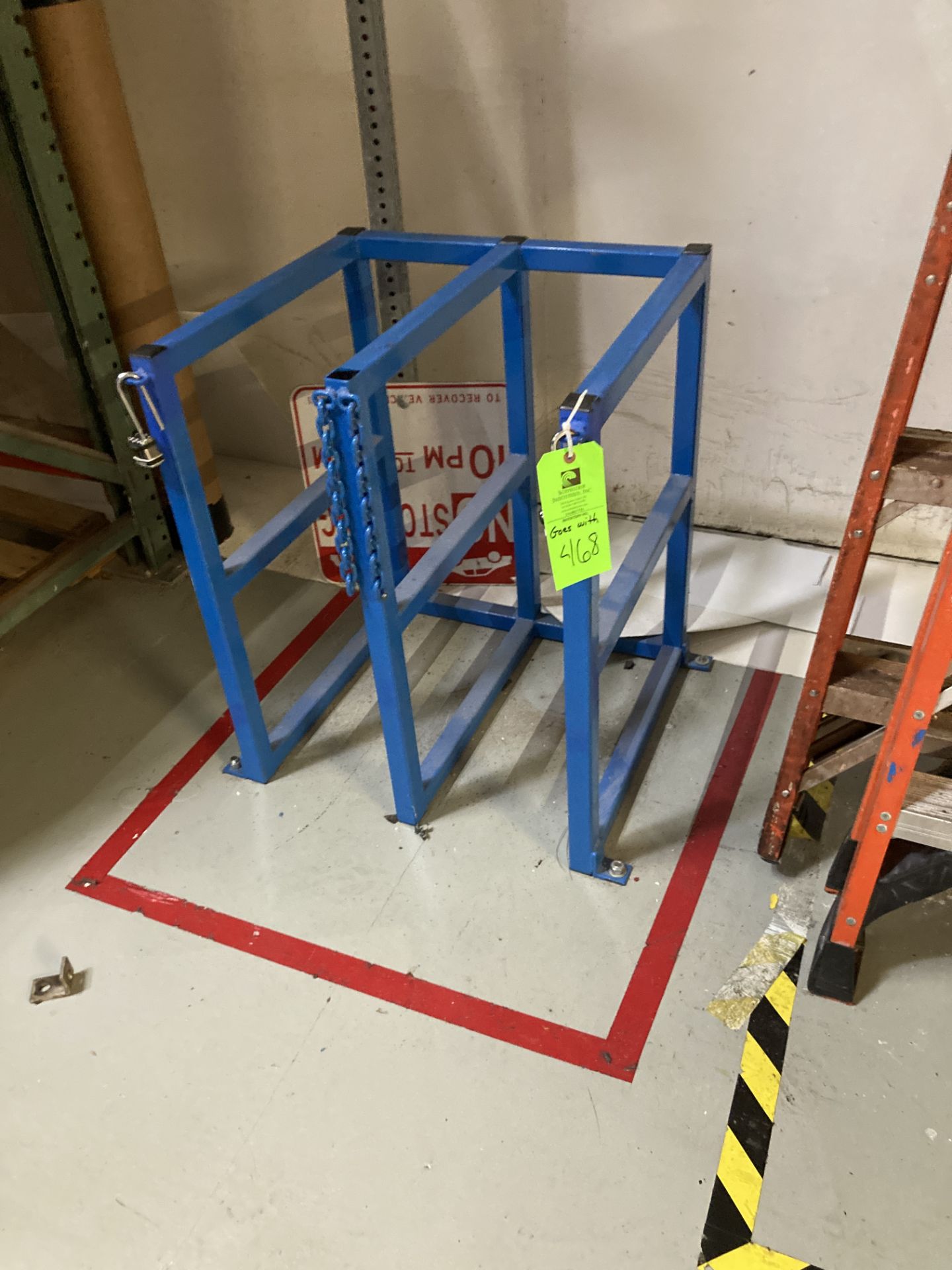 LOT OF 2 floor mount cylinder storage racks Rigging Fee: $ 75