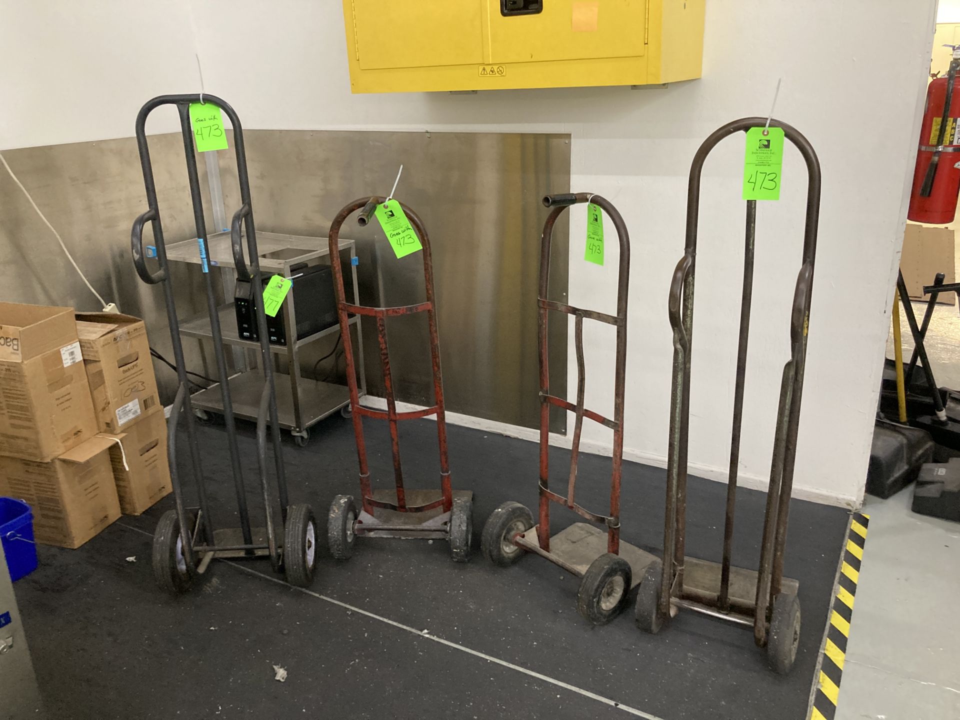 LOT OF 4 metal hand truck dolly Rigging Fee: $40