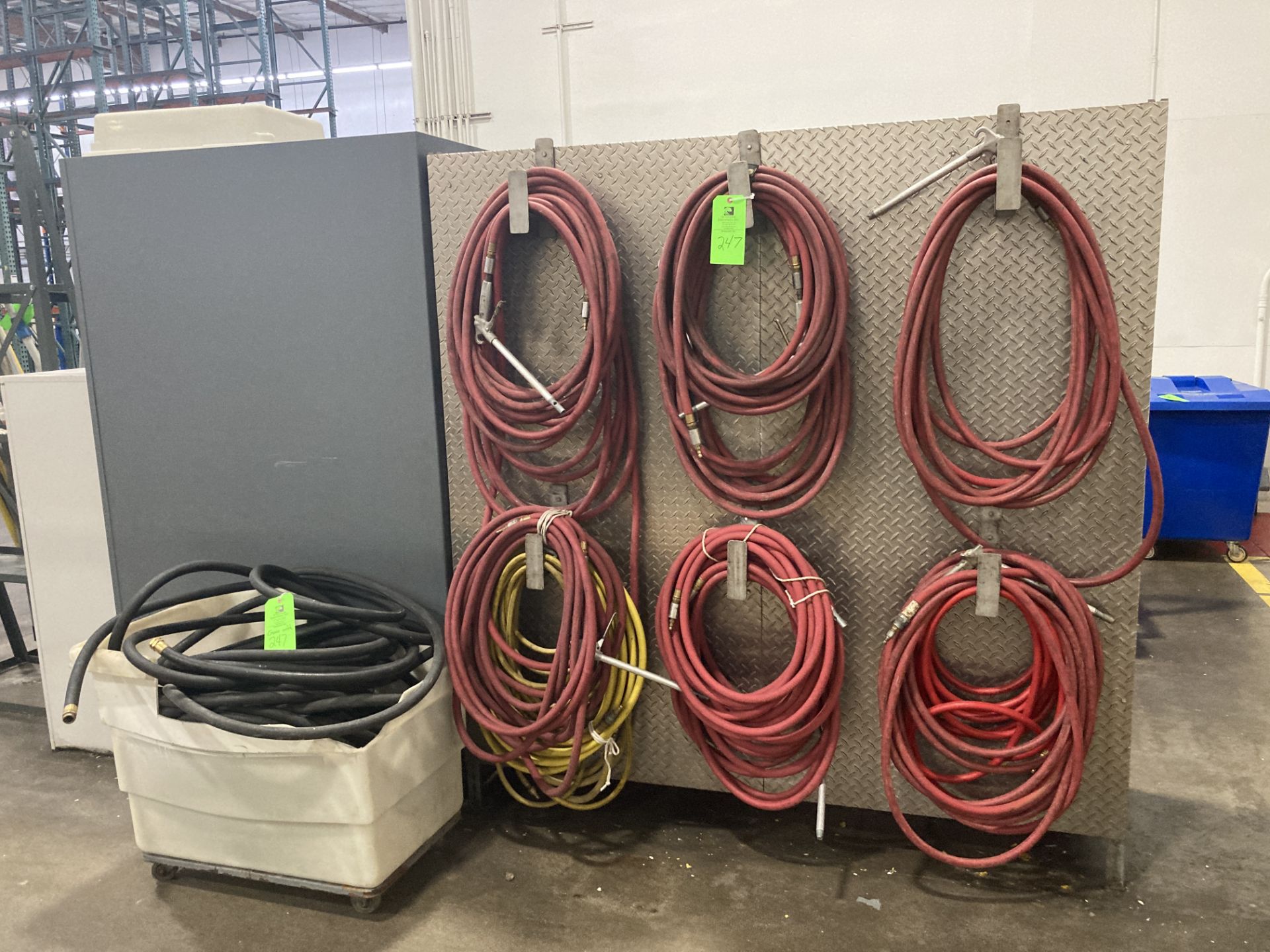 Lot of air hoses, water hoses with aluminum plating, and hanger. Rigging Fee: $ 100