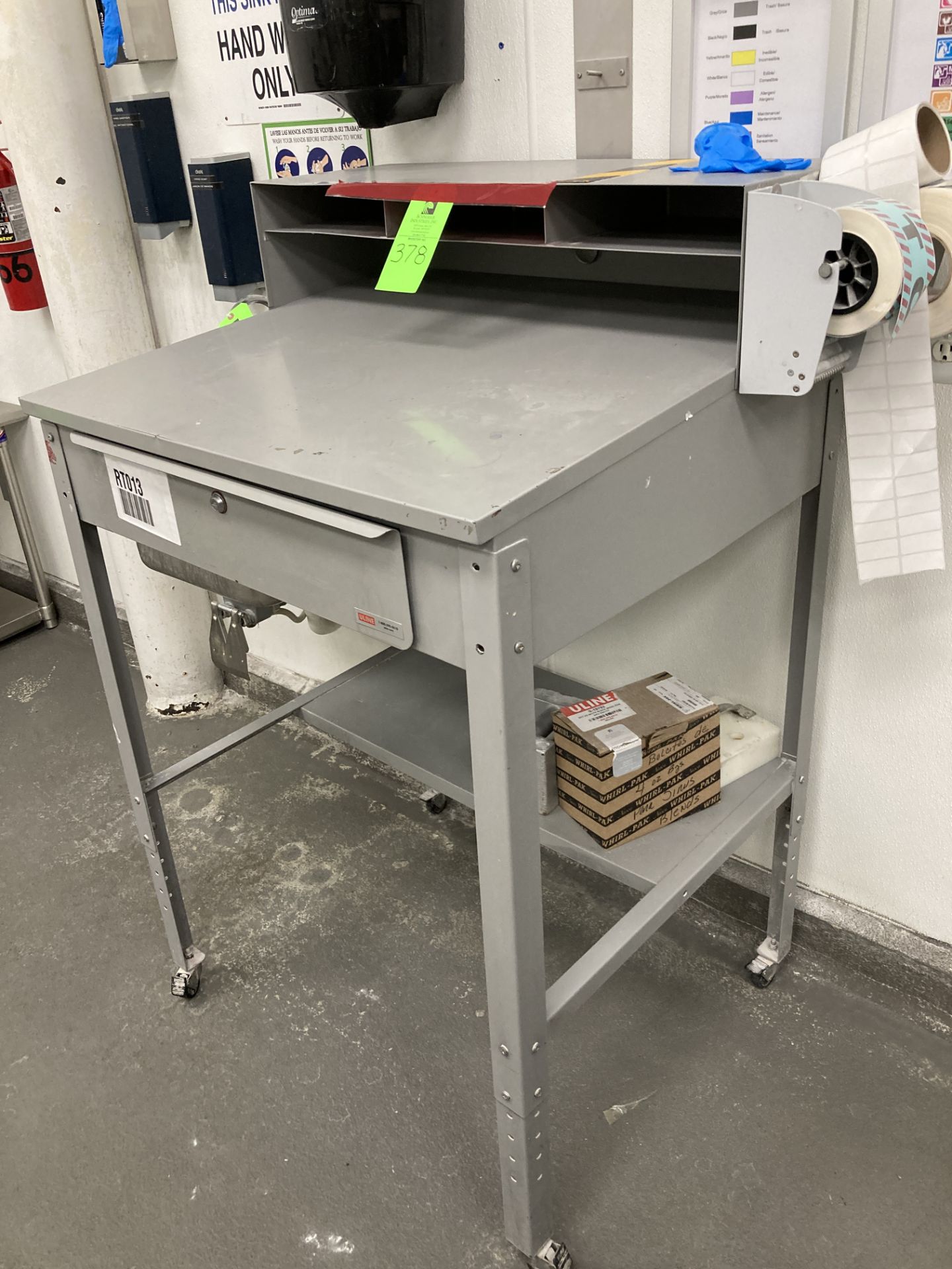 Metal workstation with casters, 34 in w x 29 in d Rigging Fee: $ 35