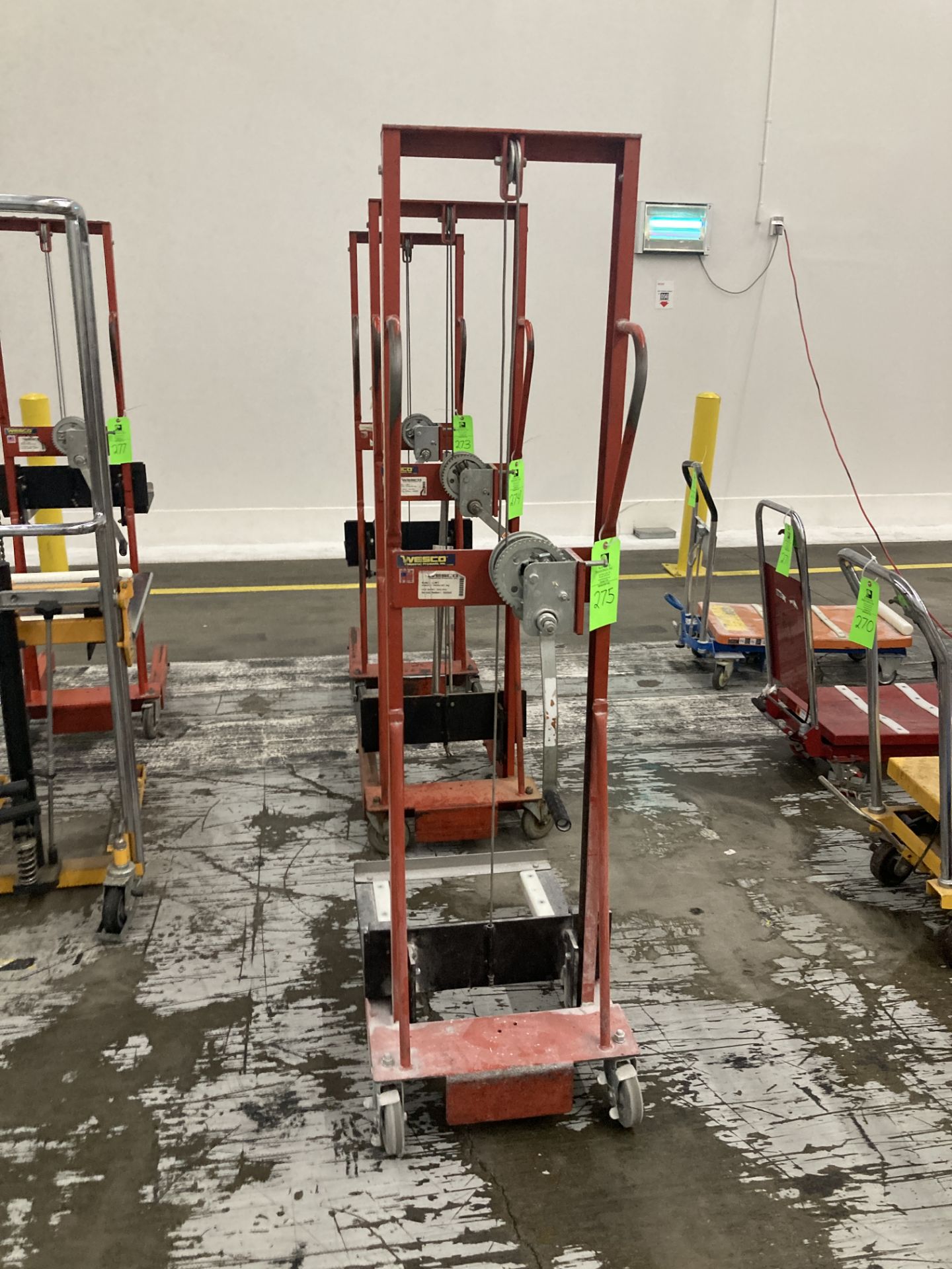 Wesco hand operated lift truck with straddle legs, approx. 500 lbs cap Rigging Fee: $ 50