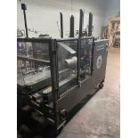 (Located in Chicago, IL ) WePackit Case Erector Model 720 XLM Case erector with 2" reconditioned Dek