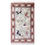 Ghom. Silk. Oriental carpet. Equestrian motif. Signed. Circa 1980.