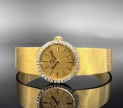 Damenarmbanduhr BAUMEN & MERCIER. 750 Gelbgold mit Diamanten.