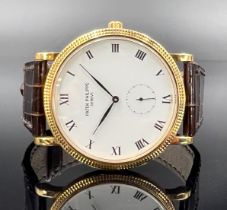 Herrenarmbanduhr PATEK PHILIPPE Calatrava Clous de Paris. 750 Gelbgold. Ref. 3919.