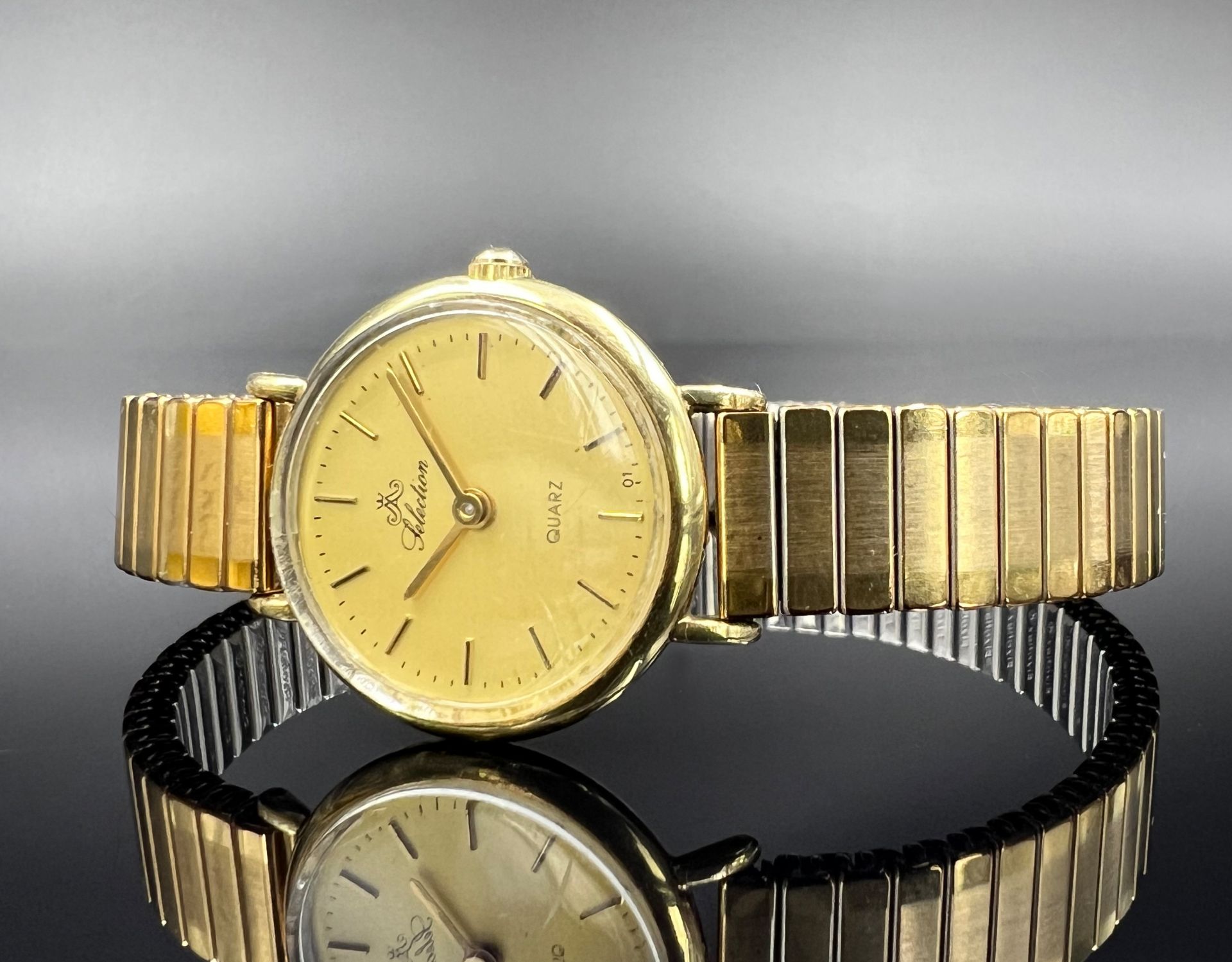 CELECTION wristwatch. Case 585 yellow gold. Quartz.