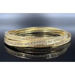 3-piece bangle. 750 yellow gold with diamonds.