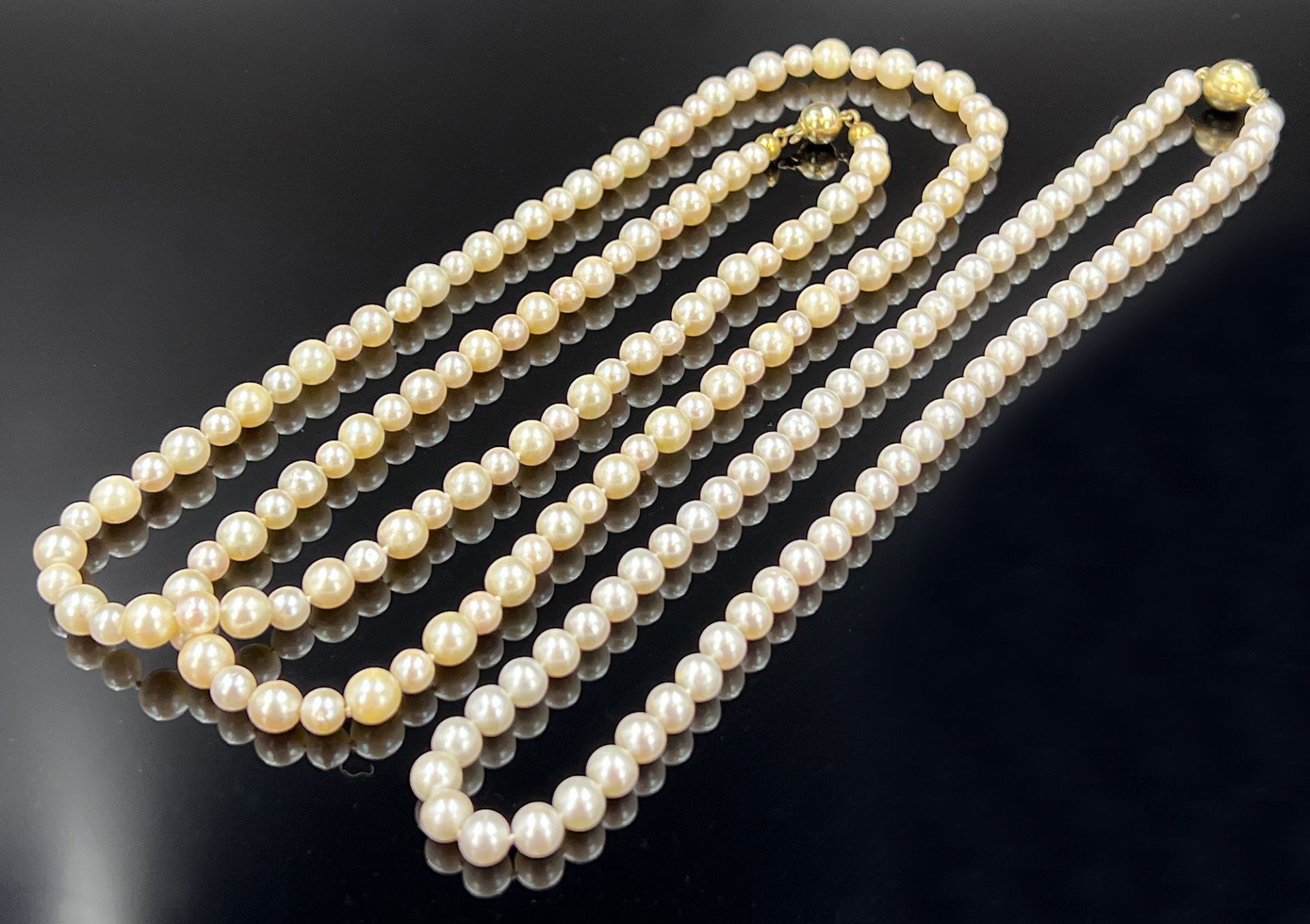 Two pearl necklaces.