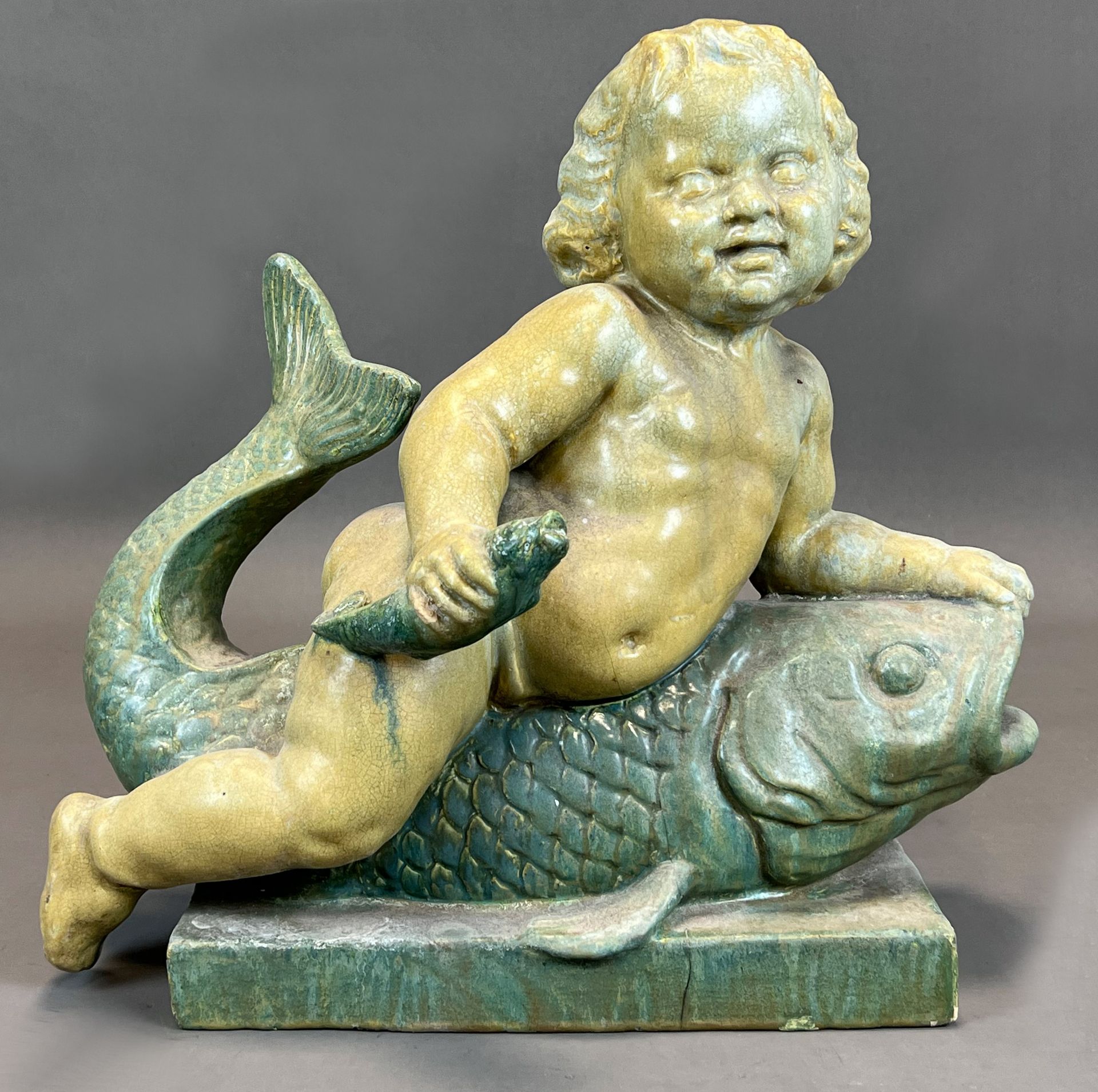 Majolica figure. Putto on a fish. Early 20th century. - Image 2 of 13