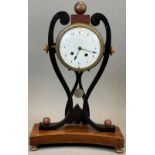 Antique mantel clock with striking mechanism and enamelled dial. 1st half of the 19th century.