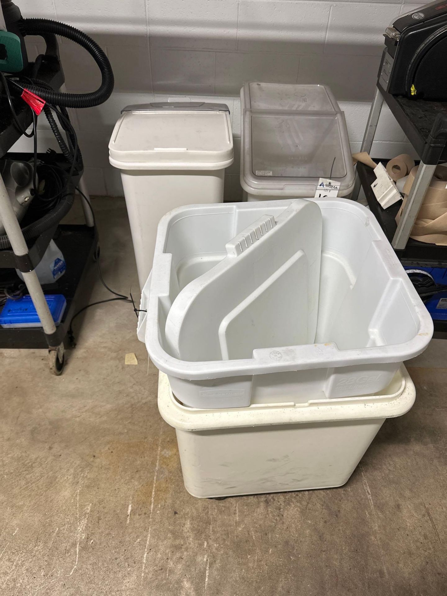 4 plastic tubs on wheels