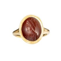 A Roman carnelian intaglio of a young Emperor wearing a radiating crown, set in a modern 18ct gold r