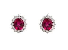 An impressive pair of pink tourmaline and brilliant cut diamond cluster earrings