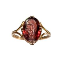 A fine intaglio in garnet of a young boy, the stone set in a fine 19th Century gold mount