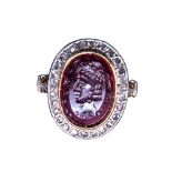 A garnet intaglio ring set with a portrait of a Sassanian ruler