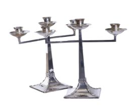 Art Deco, A pair of silver three light candlesticks