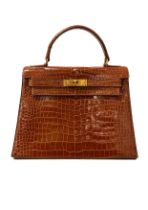 Hermès, 1957, A Kelly 28 miel crocodile leather handbag