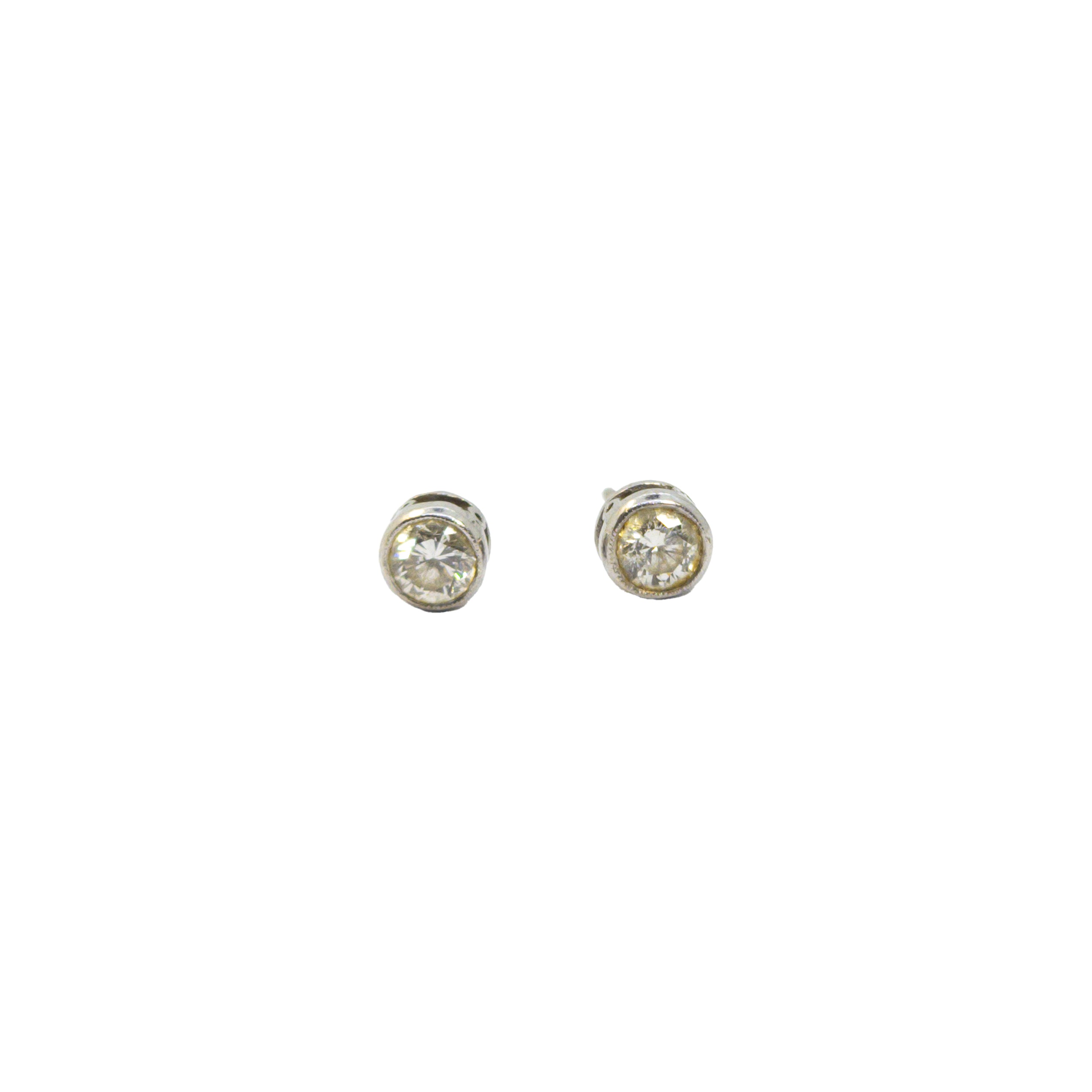 British, Circa 1960, A pair of diamond and platinum ear studs