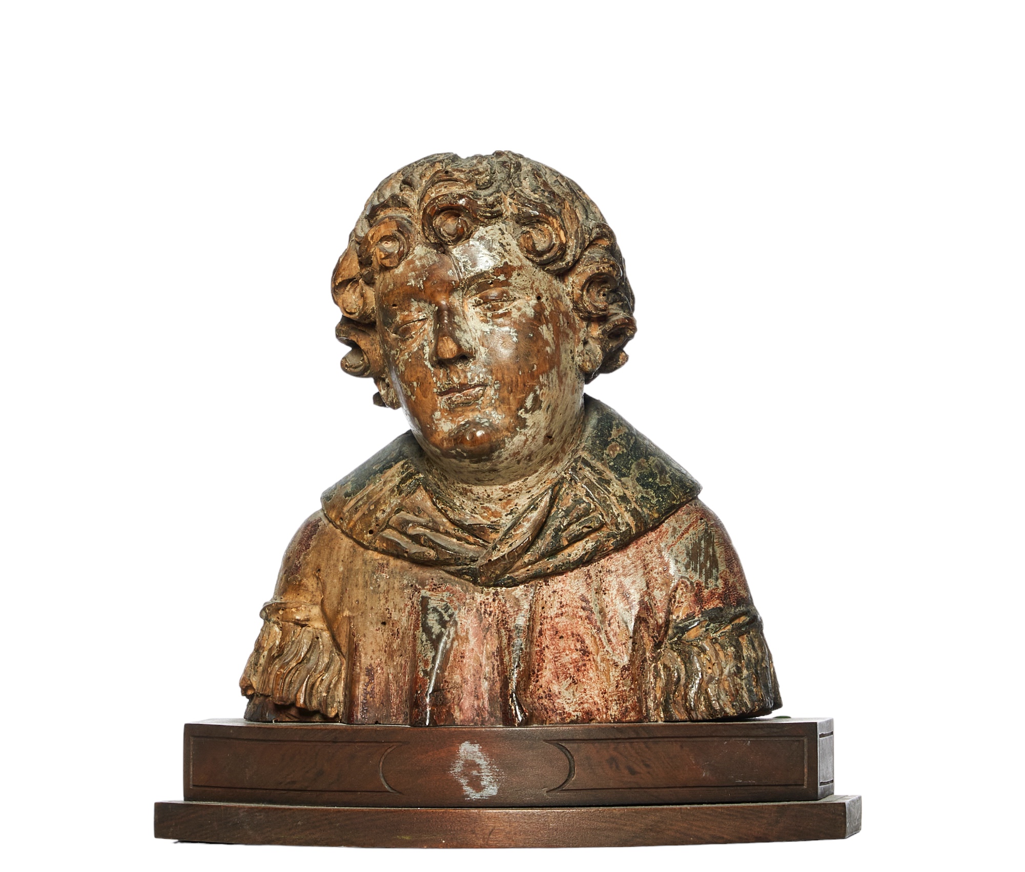 British, 16th Century, A carved walnut and polychrome bust of a saint