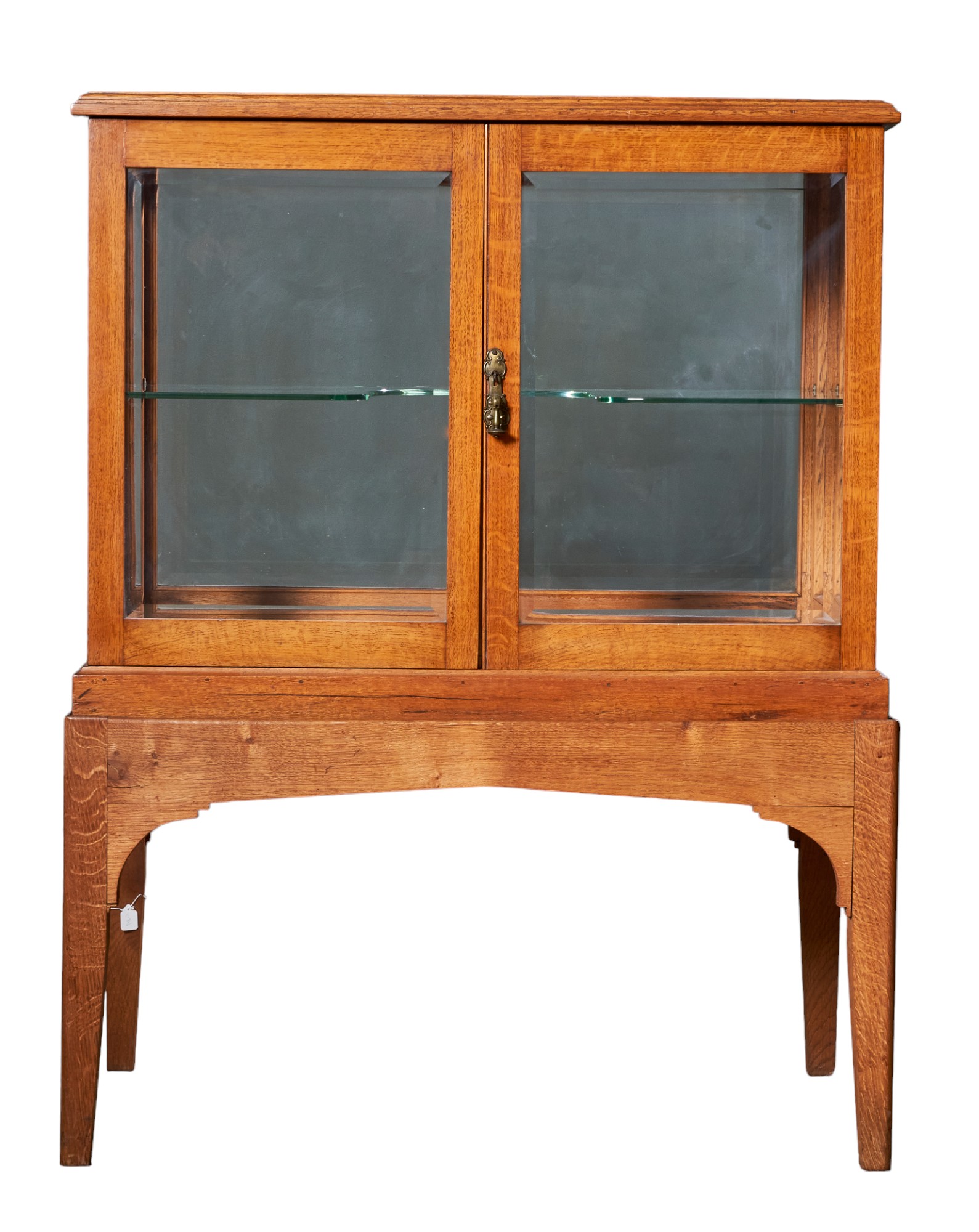 British, 20th Century, An oak glazed cabinet on stand