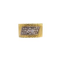 British, Circa 1970, A diamond and 18 carat yellow gold band ring