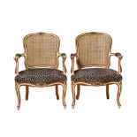 20th Century, A pair of cane and upholstered armchairs