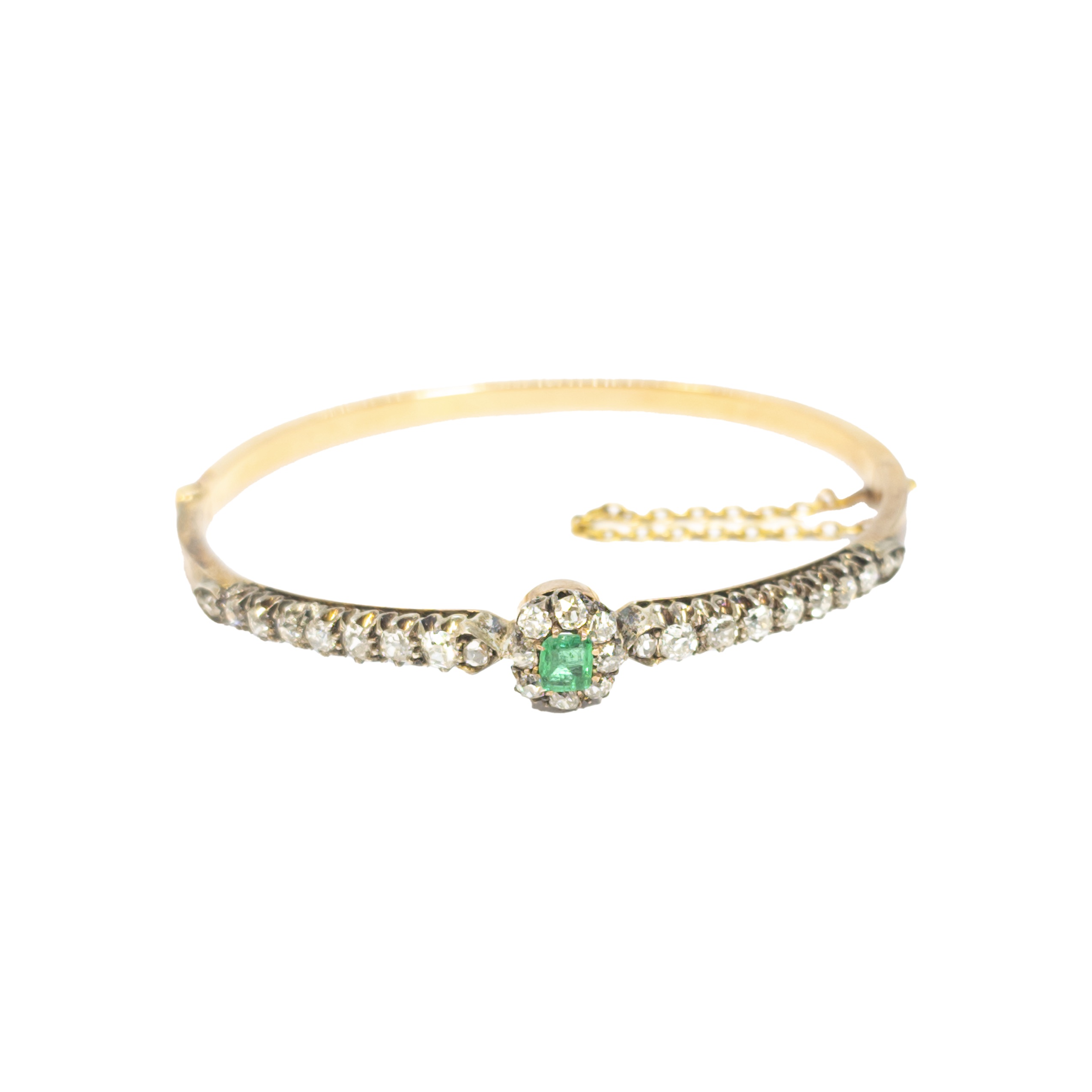 British, Circa 1880, A pretty emerald, diamond and 18 carat rose gold bangle