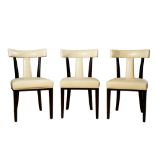 Contemporary, Ben Whistler, A suite of 12 ebonised wood and leather upholstered dining chairs