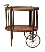 Circa 1930, An oak and brass wheeled serving trolley