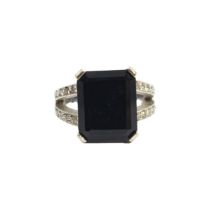 British, Contemporary, An 18 carat white gold, diamond and black gemstone dress ring