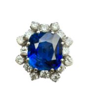 European, Circa 1970, A fine unheated Burmese sapphire and diamond cluster dress ring