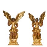 Italian, 19th Century, A pair of giltwood and polychrome decorated models of angels