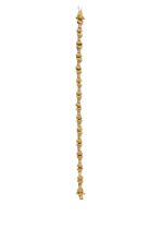 European, Circa 1980, An 18 carat yellow and white gold bow tie design bracelet