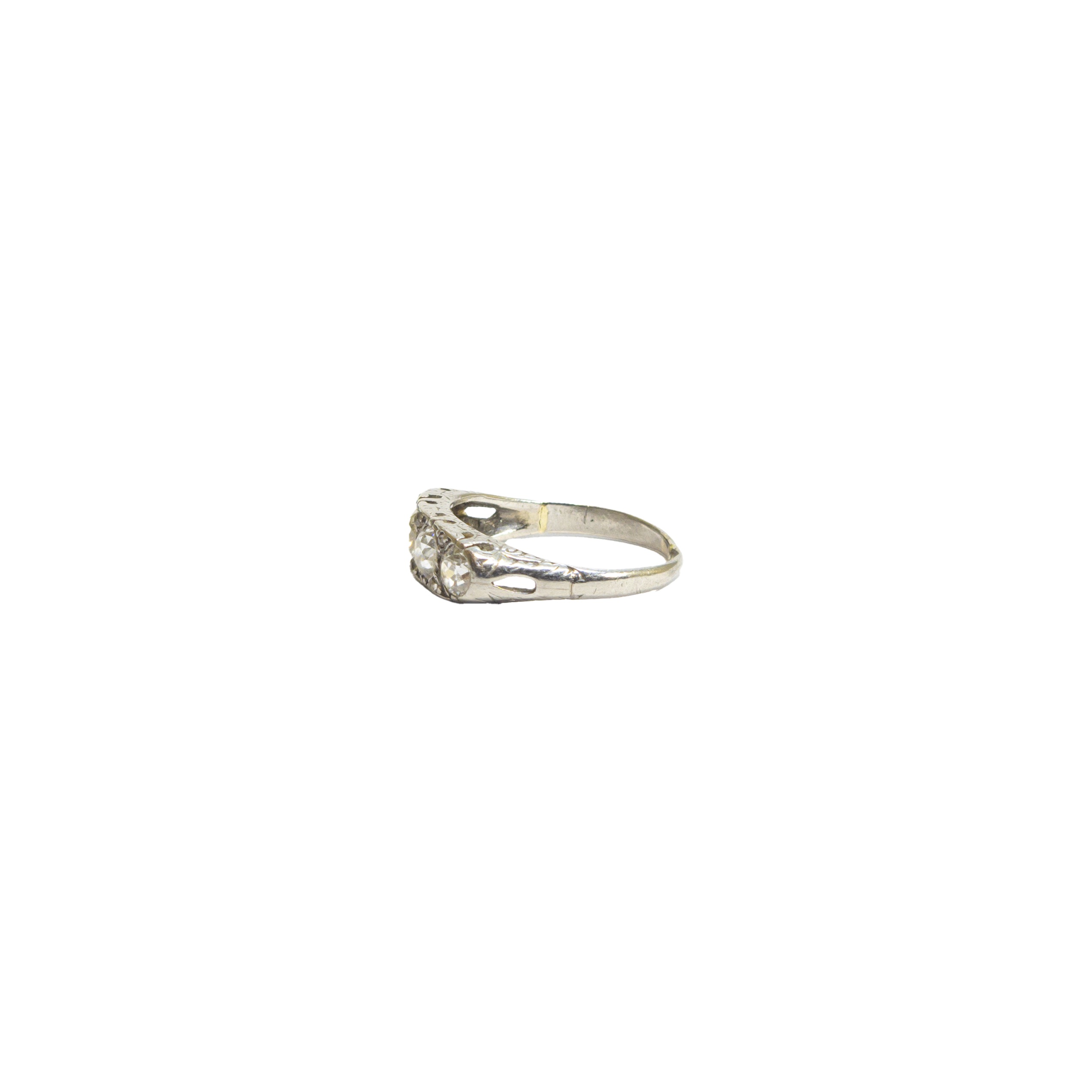 British, Late 19th Century, A four stone diamond and platinum half hoop ring - Image 2 of 4