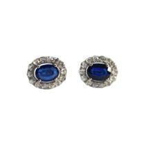 British, Contemporary, A pretty pair of sapphire and diamond cluster earrings