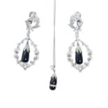 British, Circa 1960, An elegant pair of diamond and white gold scroll and wreath pendant earrings