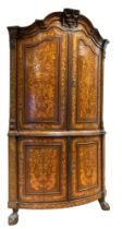 Dutch, 18th Century, Circa 1790, A marquetry bow-fronted corner cabinet