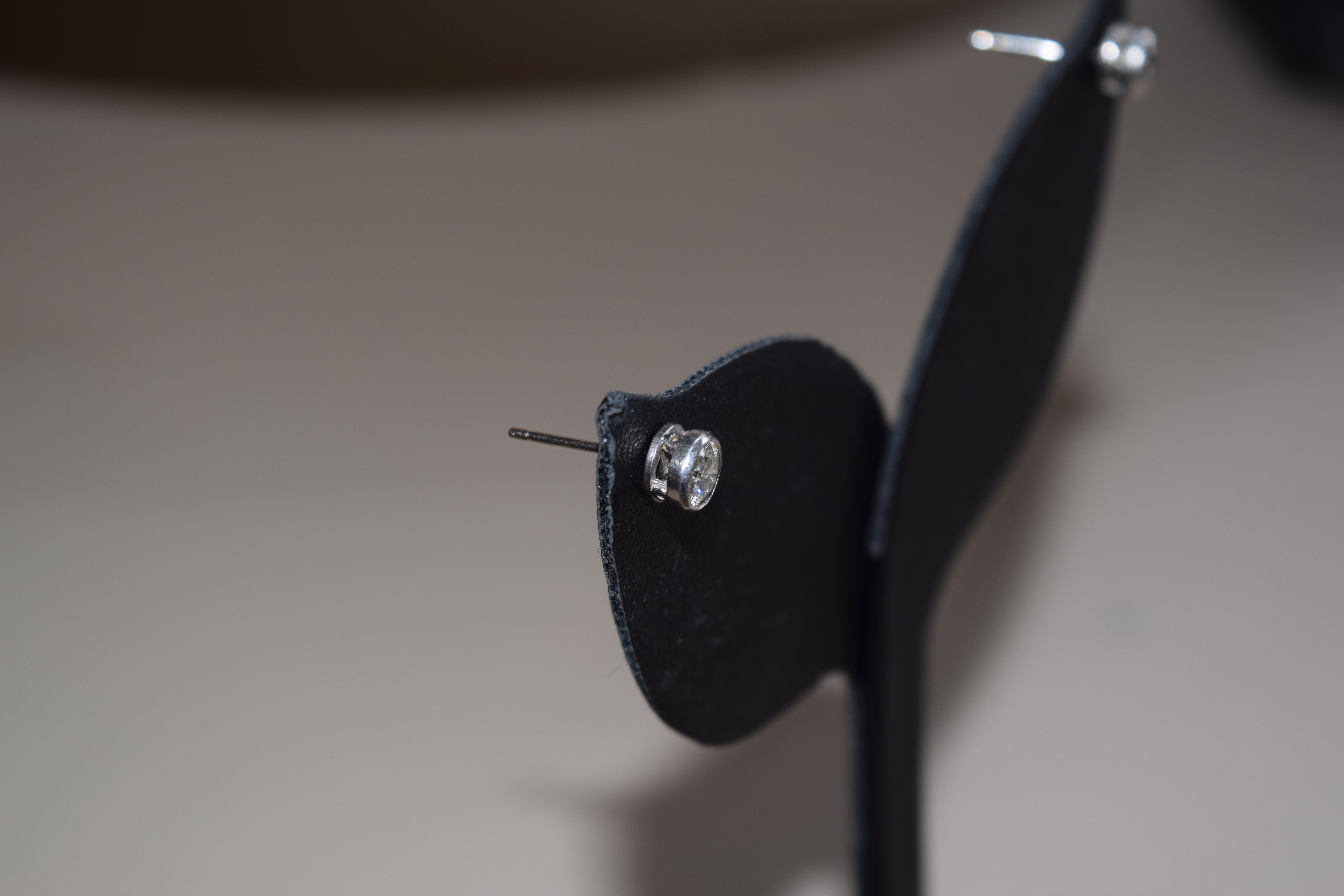 British, Circa 1960, A pair of diamond and platinum ear studs - Image 4 of 4