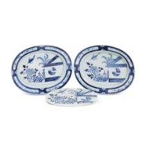 A pair of Chinese export porcelain blue and white 'Cuckoo in the House' pattern oval serving dishes