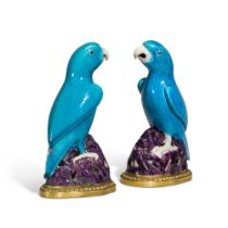 A pair of Louis XV gilt-bronze mounted Chinese porcelain model of parrots, the porcelain Kangxi