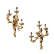 A pair of Louis XV style gilt-bronze three-light wall appliques, 19th century