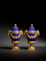 A pair of Louis XVI style gilt-bronze-mounted blue-ground porcelain vases and covers, 19th century