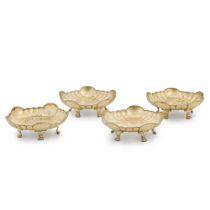 A set of four George II silver-gilt dishes, maker's mark only, WC, circa 1750