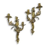 A pair of Louis XV style gilt-bronze two-light wall appliques, second quarter 19th century